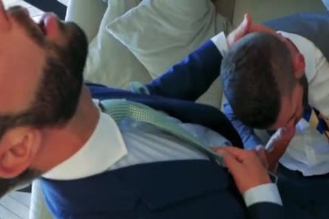 two Suited fellows pounding